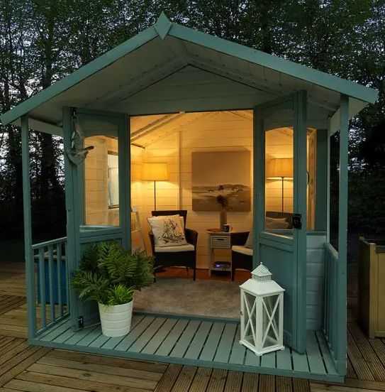 Beautiful wooden summer house at dusk